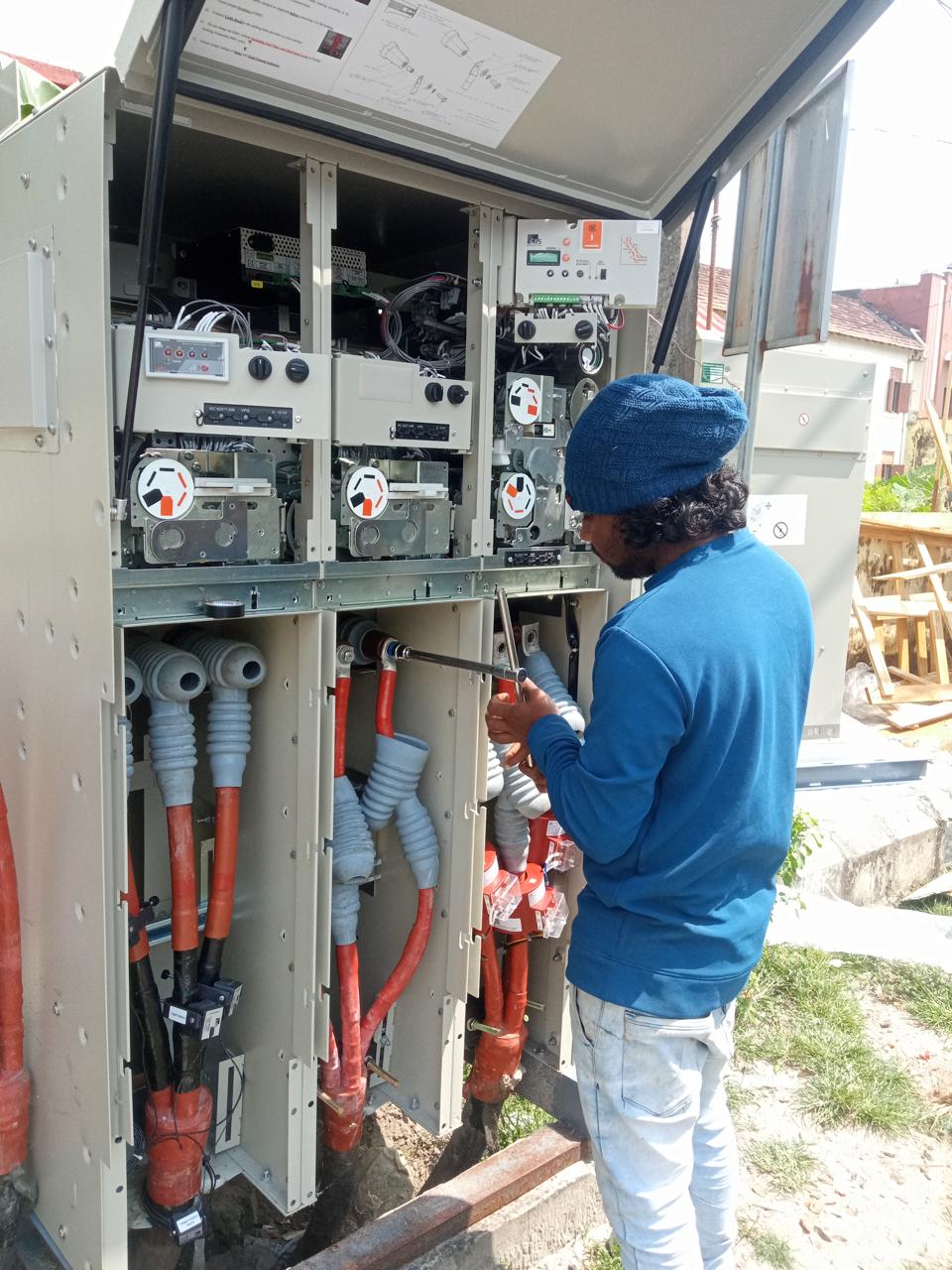 Technician performing maintenance for High Mast Lighting AMC, Elamkunnapuzha Panchayat